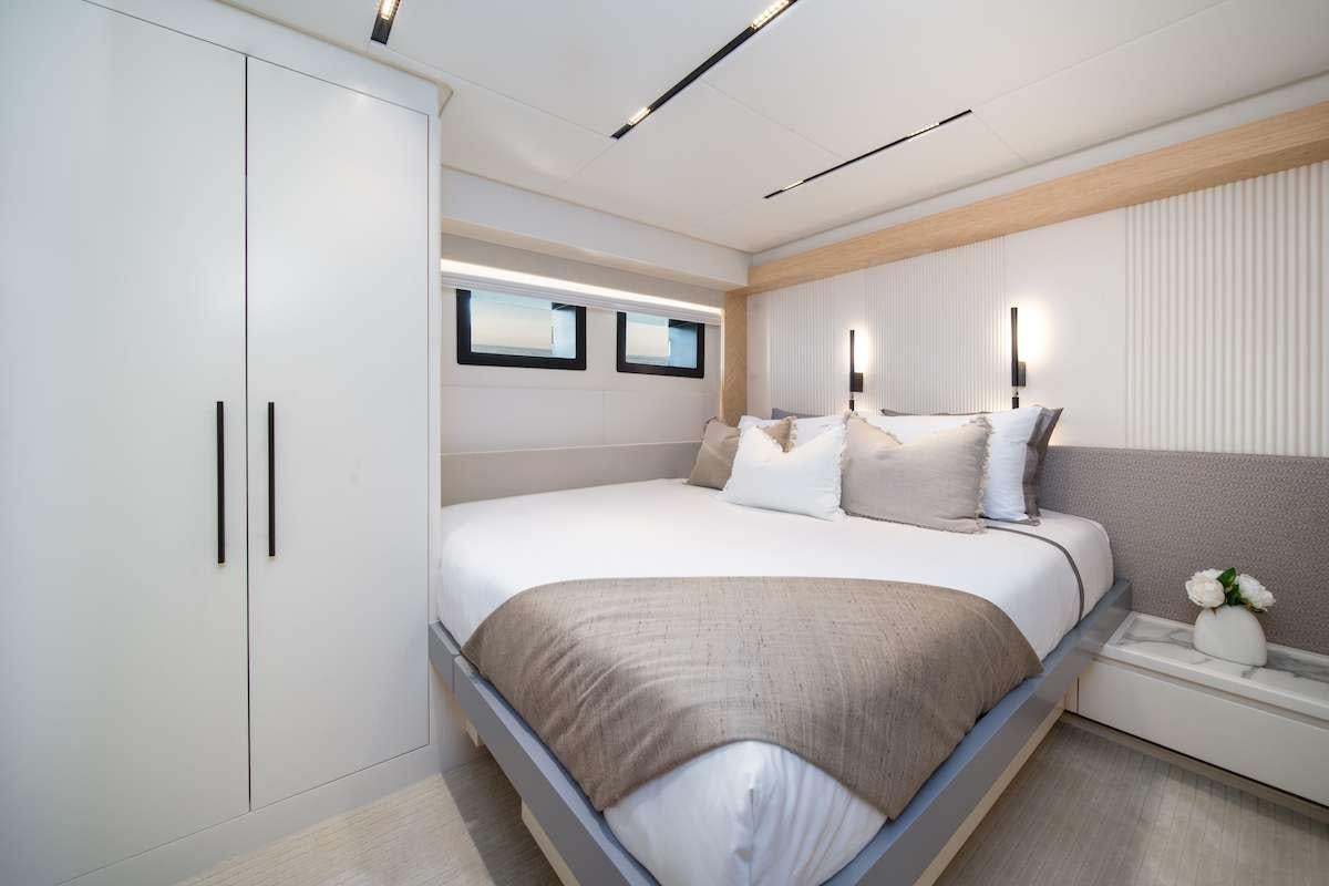 a bed in a room aboard BLUESTONE 1 Yacht for Charter