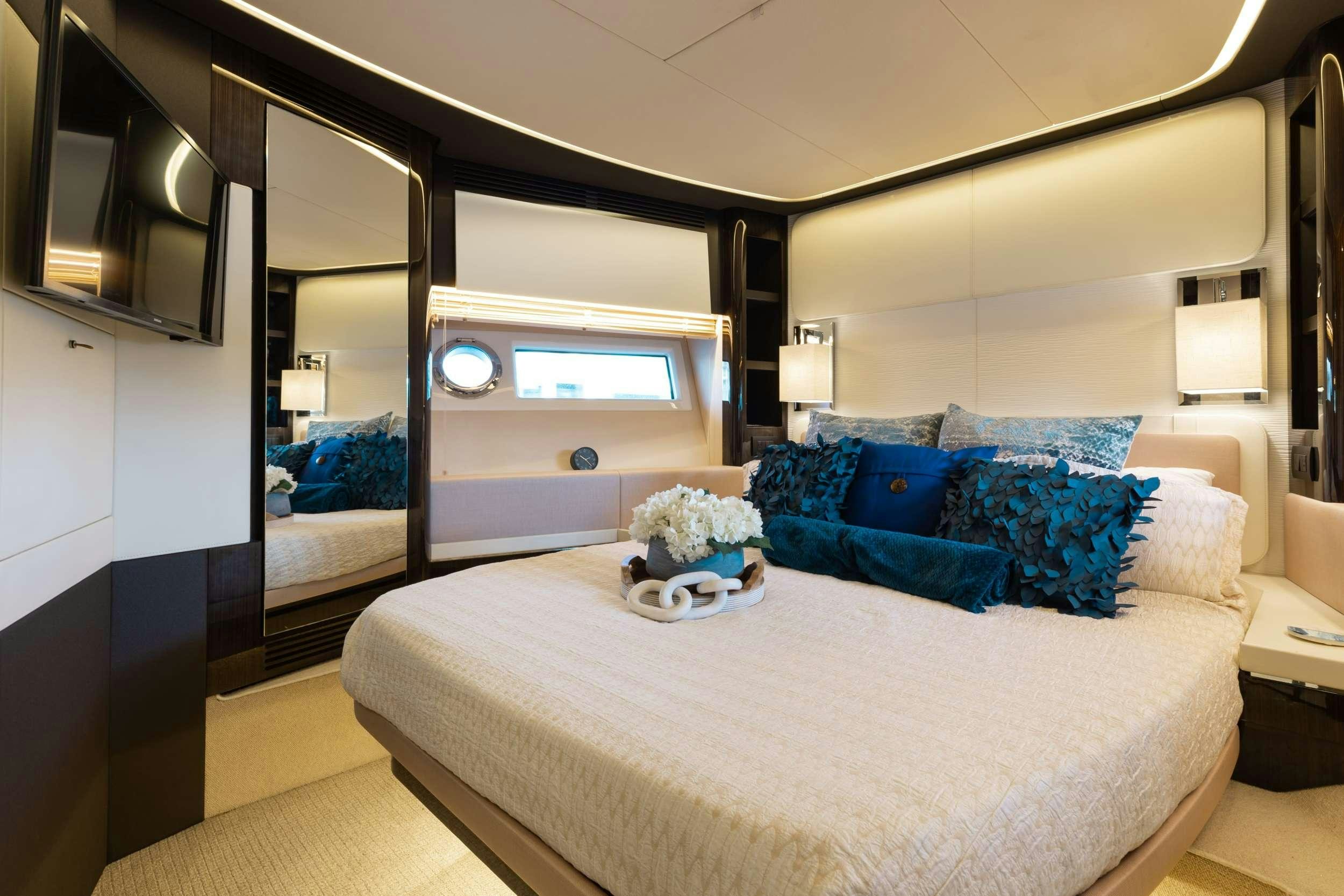 a bedroom with a large bed aboard HIGH MAINTENANCE Yacht for Charter