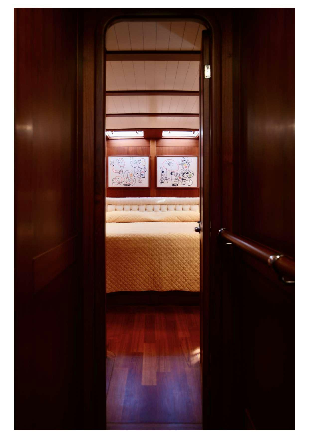 a window with a bed aboard MARELLA Yacht for Charter