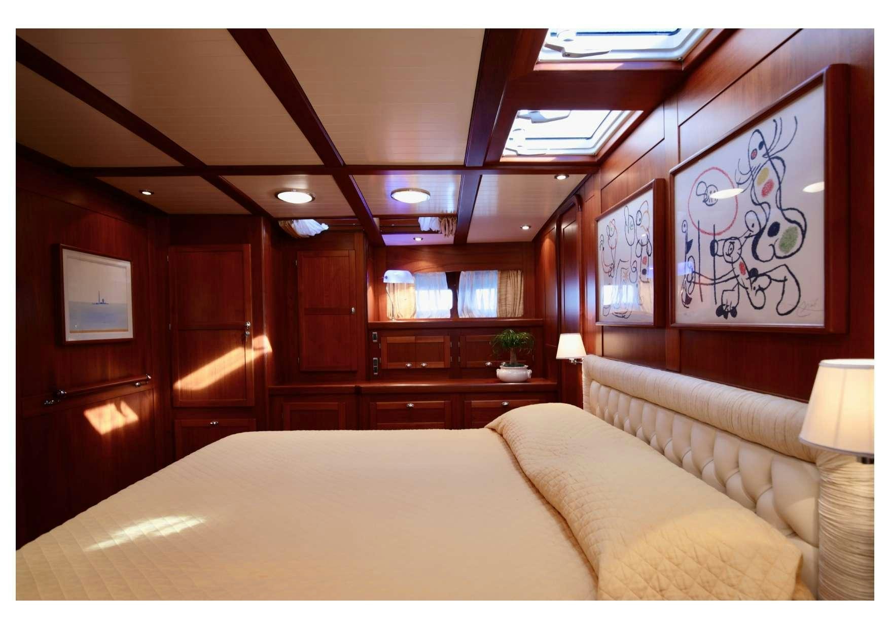 a bed in a room aboard MARELLA Yacht for Charter