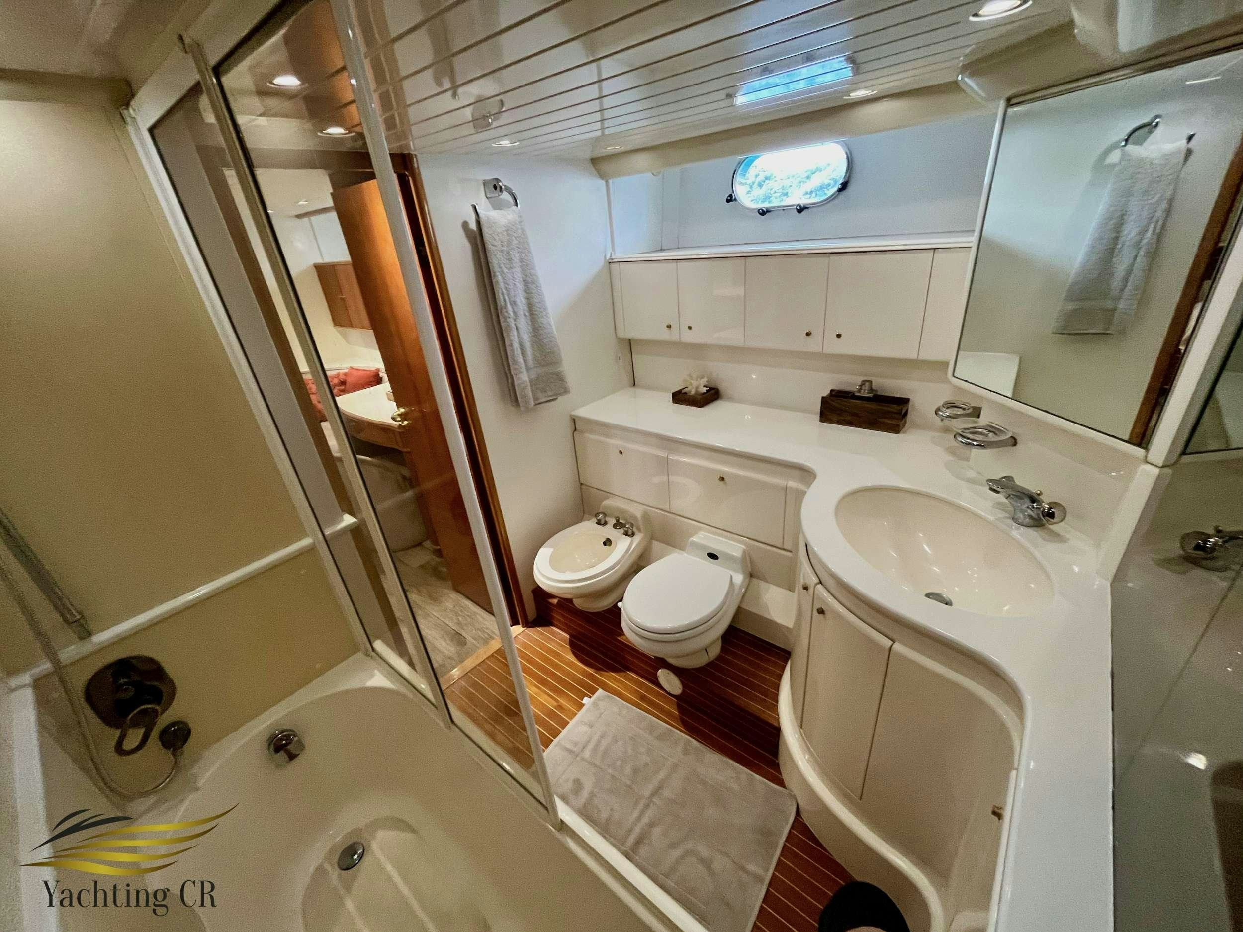 a bathroom with a shower and toilet aboard MORENA I Yacht for Charter