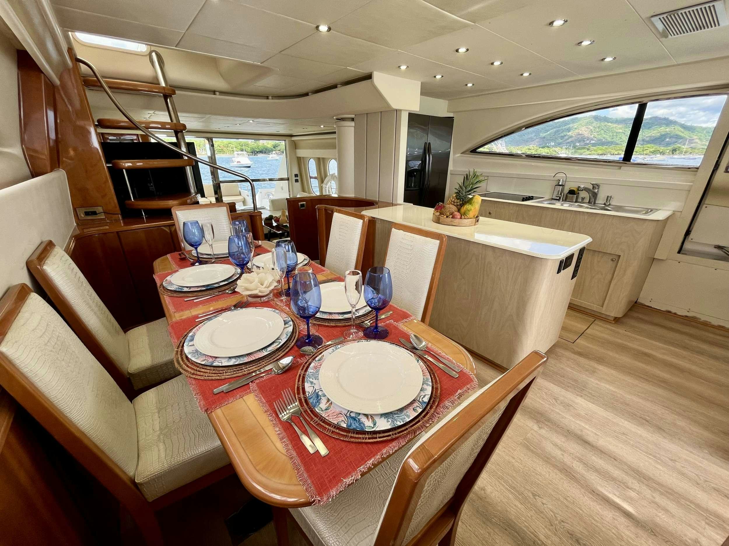 a dining room with a table and chairs aboard MORENA I Yacht for Charter