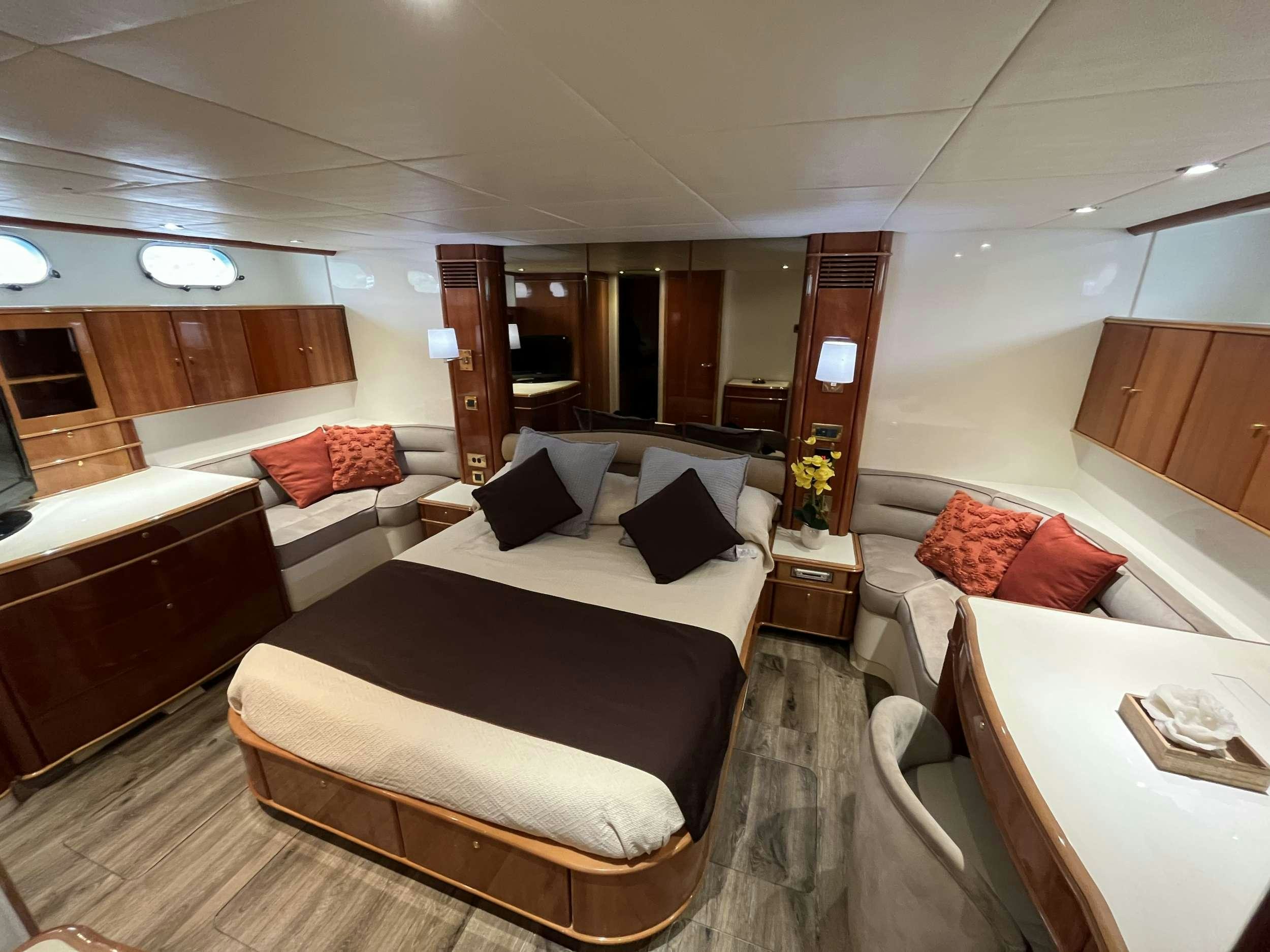 a hotel room with a bed and a desk aboard MORENA I Yacht for Charter