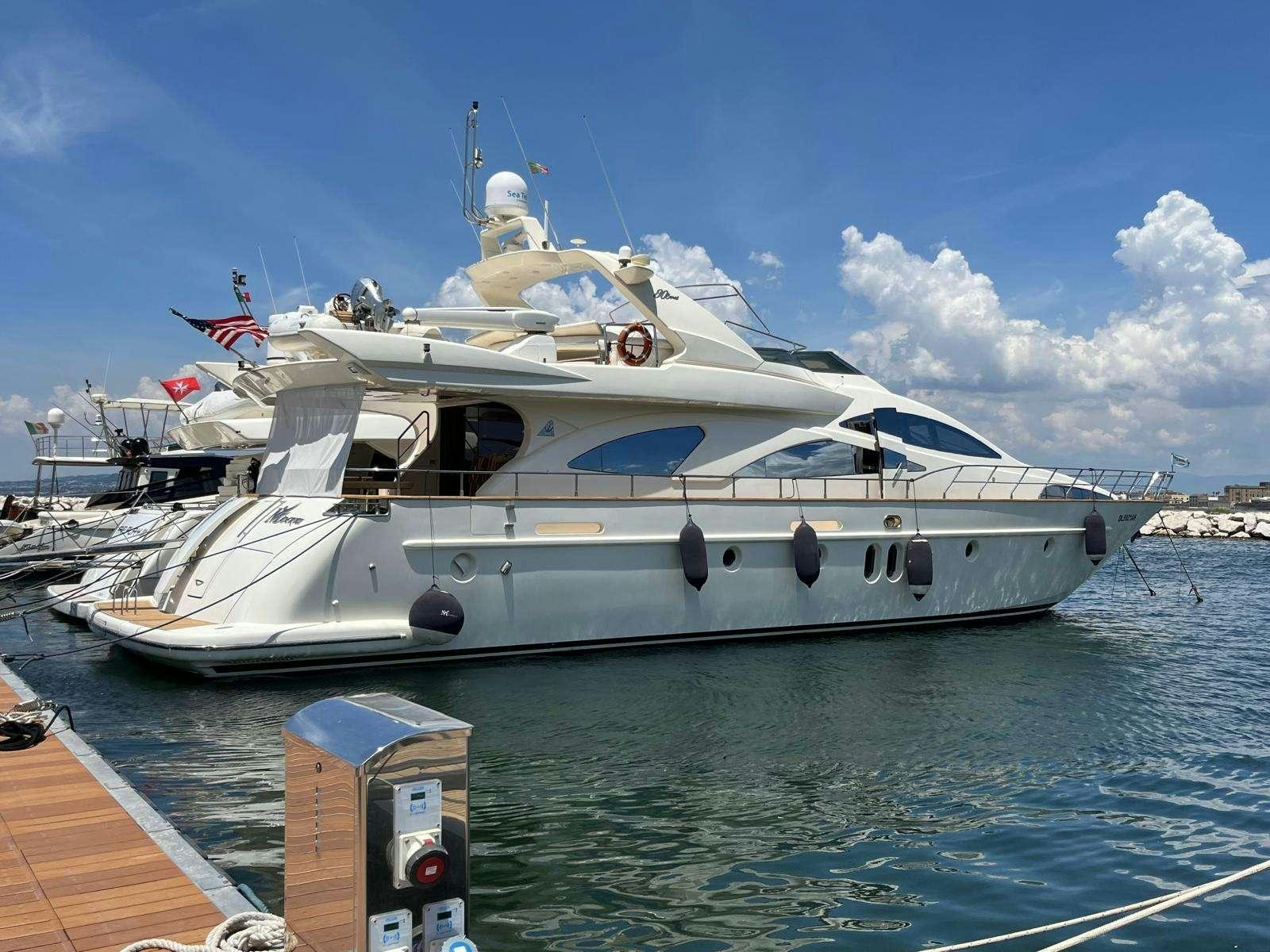 a large white yacht docked aboard MINERVA Yacht for Charter