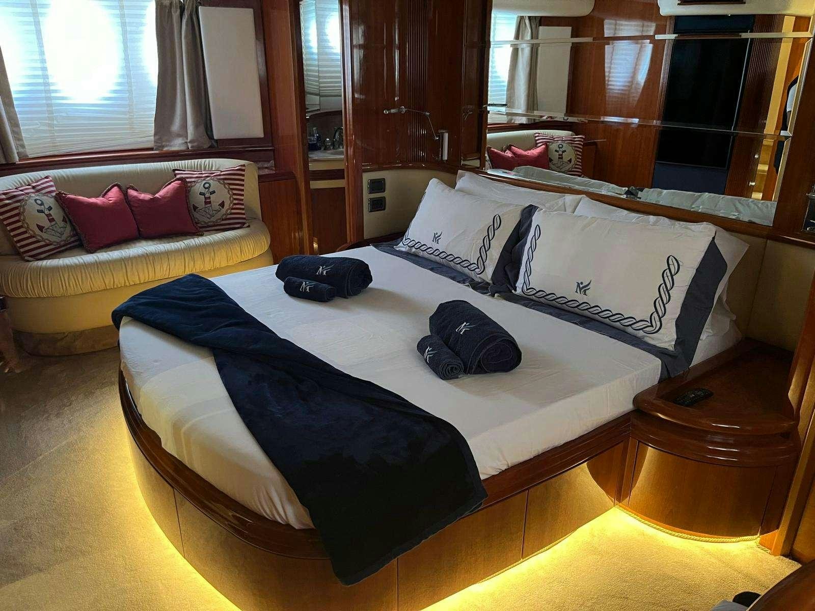 a bed with pillows and pillows aboard MINERVA Yacht for Charter