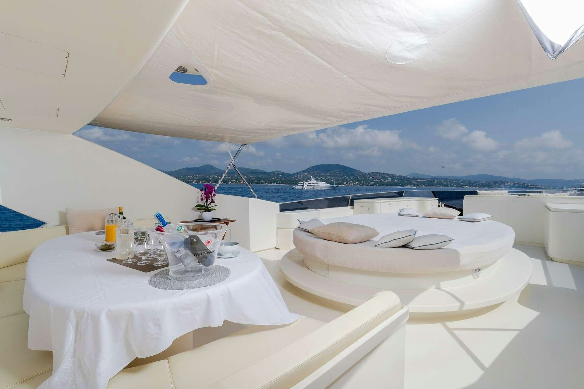 a room with a table and chairs aboard BEIJA FLORE Yacht for Charter