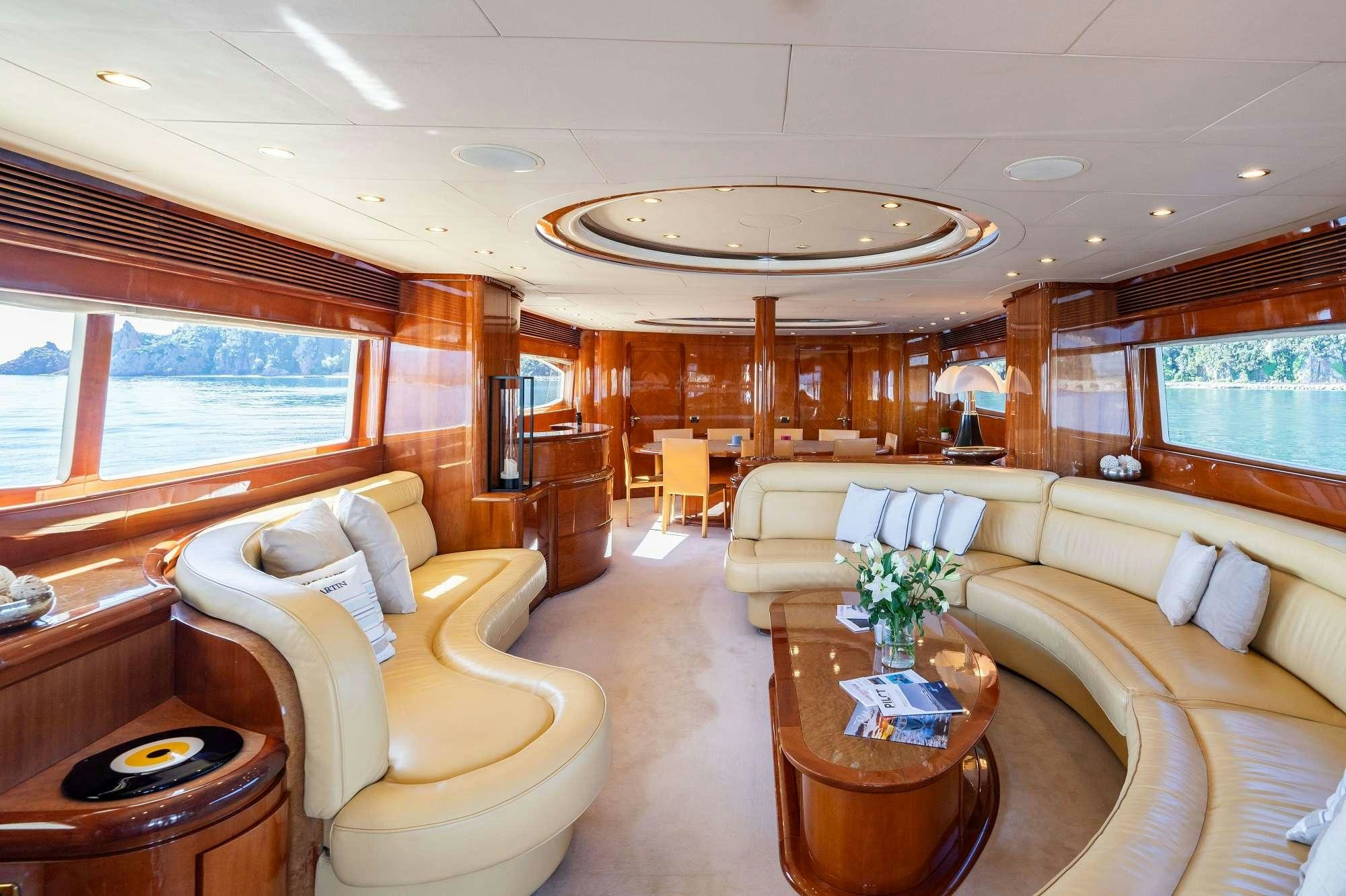 a living room with a large window aboard BEIJA FLORE Yacht for Charter