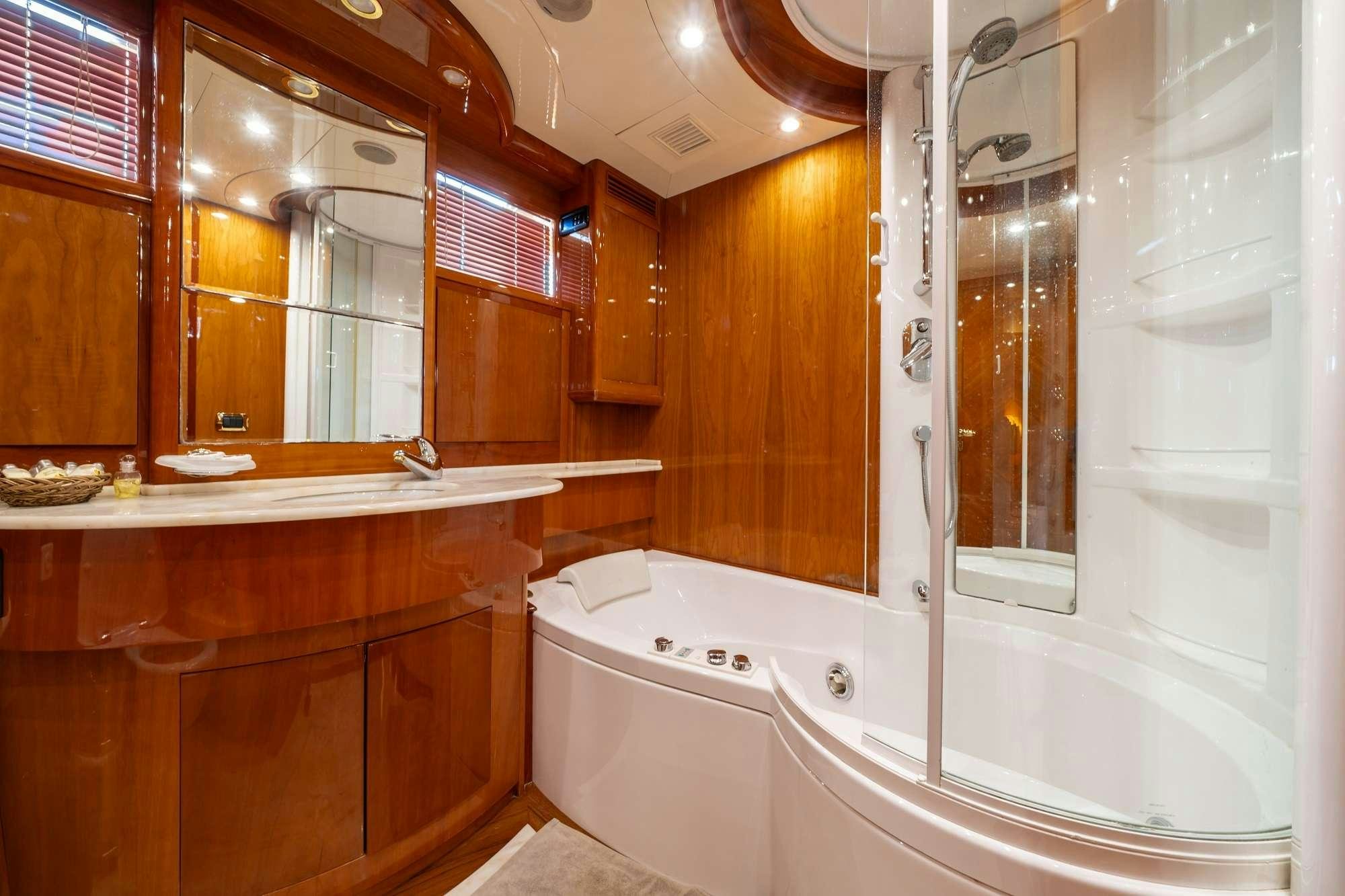 a bathroom with a bathtub and sink aboard BEIJA FLORE Yacht for Charter