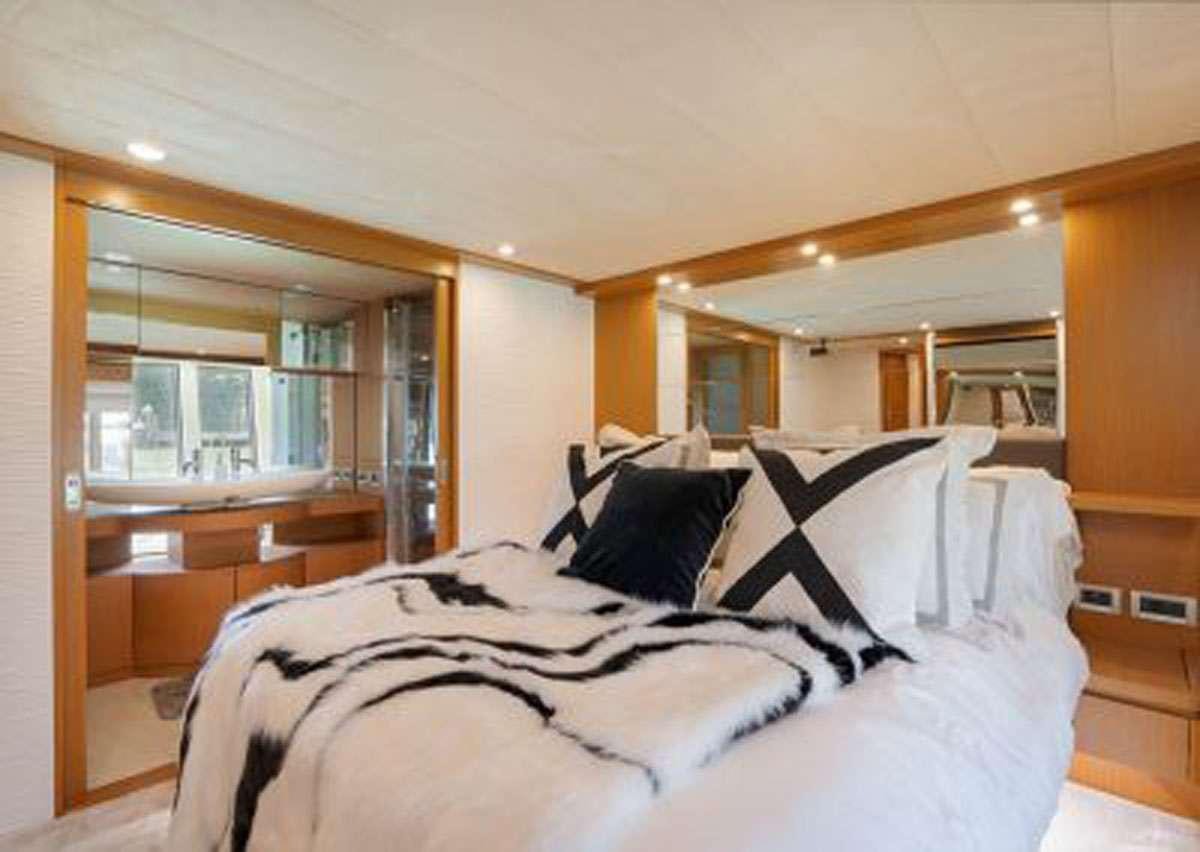 a bed in a room aboard TWE11VE Yacht for Charter