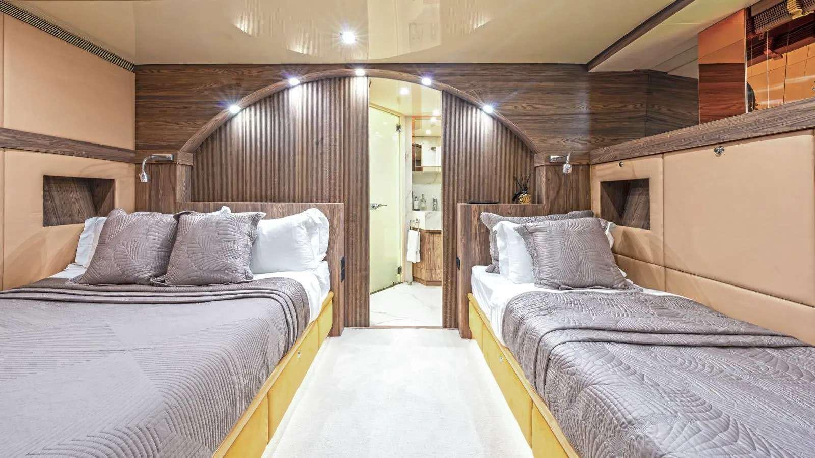 a couple of beds in a room aboard PROMETHEUS I Yacht for Charter