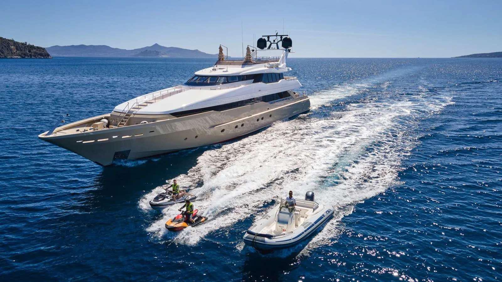 a boat carrying a boat aboard PROMETHEUS I Yacht for Charter
