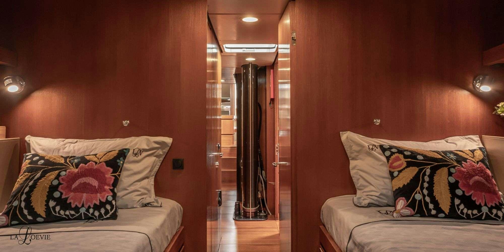 a bed in a room aboard LA LOEVIE Yacht for Charter