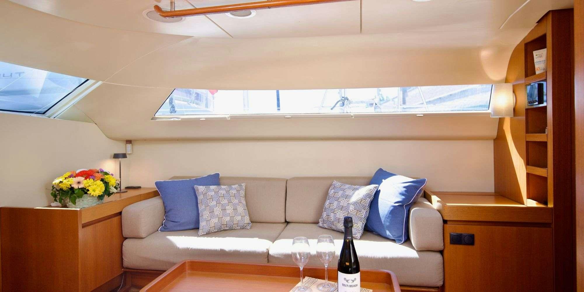 a wine bottle on a table aboard LA LOEVIE Yacht for Charter