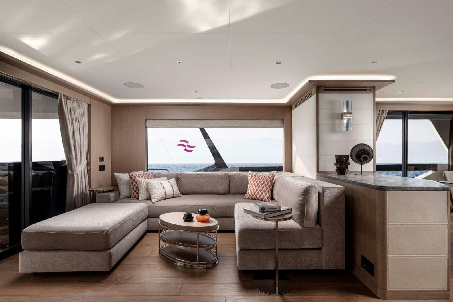 a living room with a couch and a table aboard MAJERA Yacht for Charter