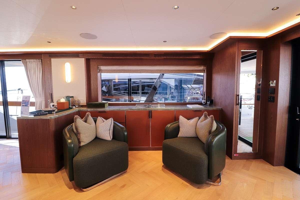 a room with a couch and a television aboard MAJERA Yacht for Charter