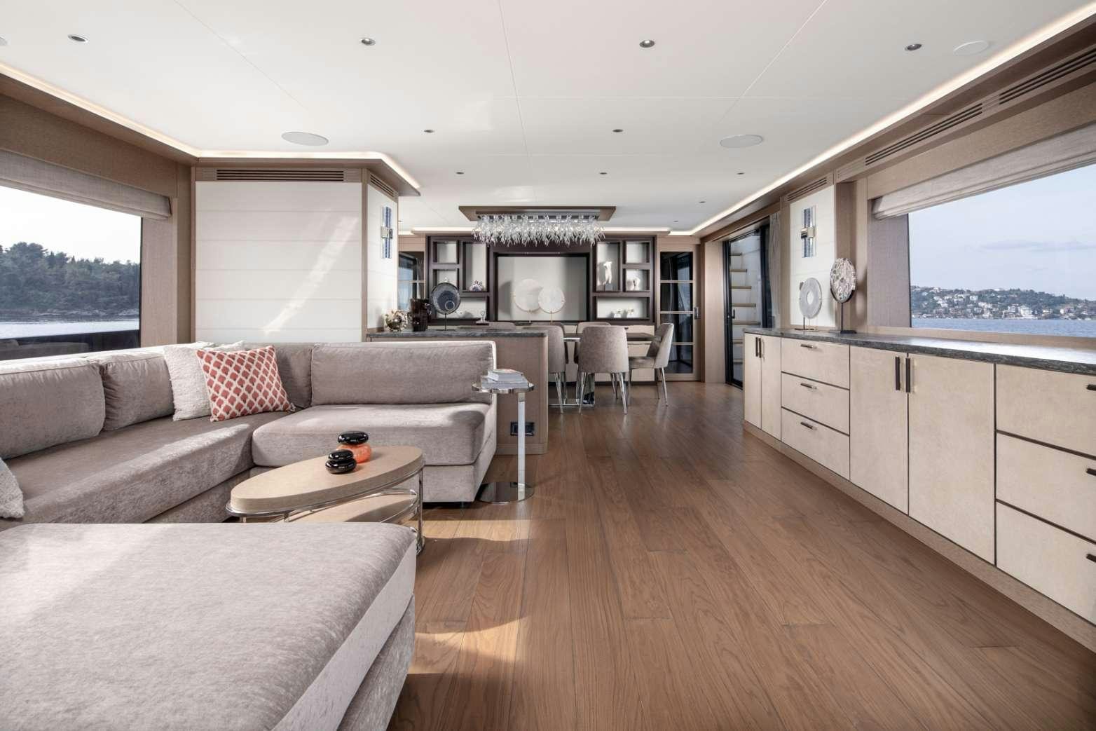 a living room with a large window aboard MAJERA Yacht for Charter