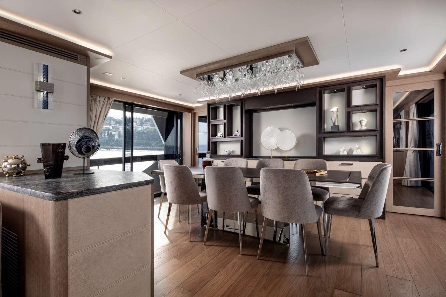 a modern looking kitchen and dining area aboard MAJERA Yacht for Charter