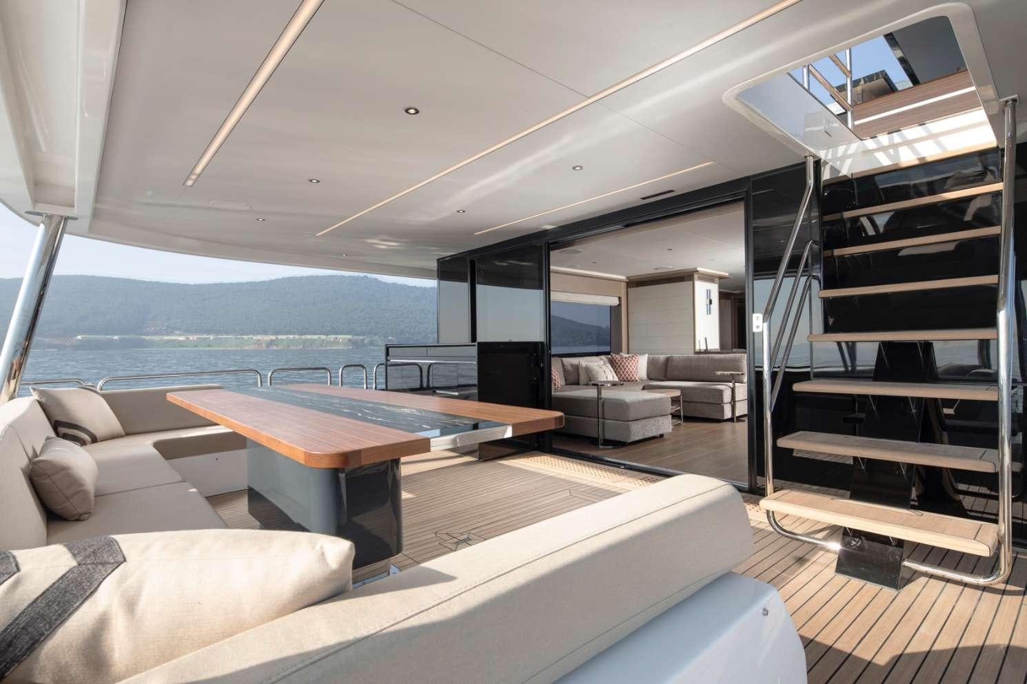 a living room with a large glass window aboard MAJERA Yacht for Charter