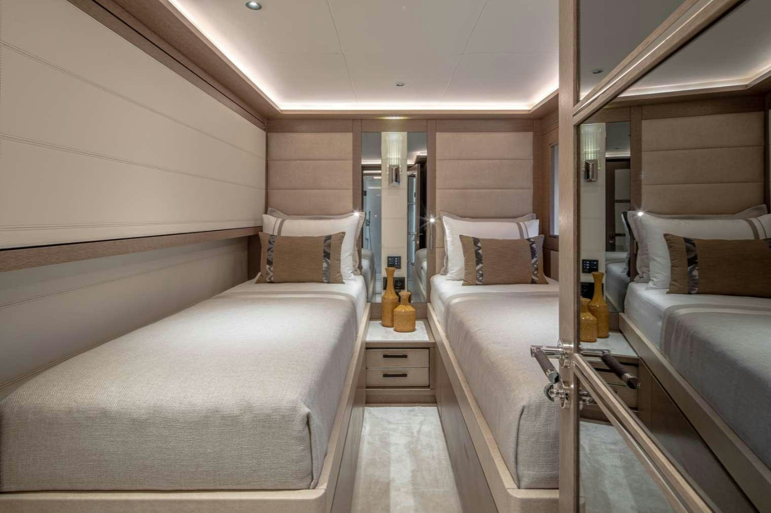 a room with two beds aboard MAJERA Yacht for Charter