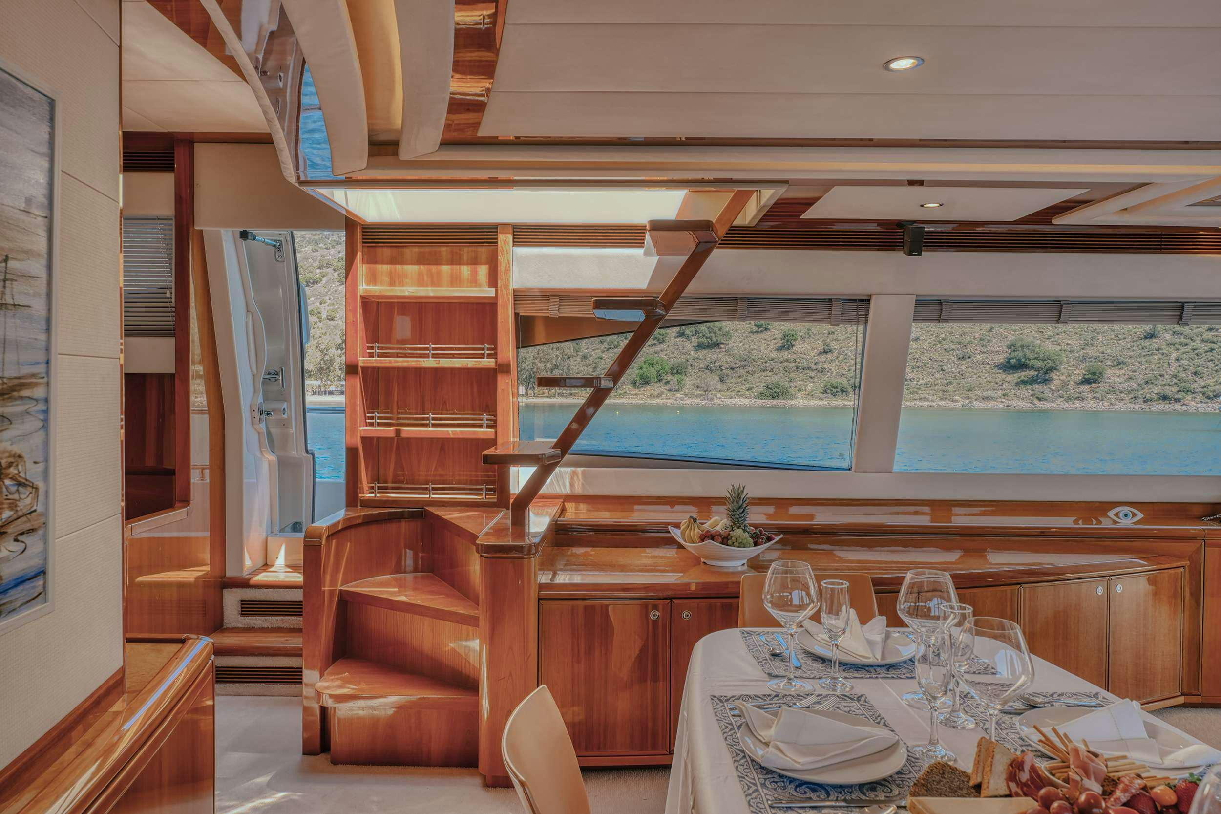 a dining table in a room aboard LIDIA Yacht for Charter