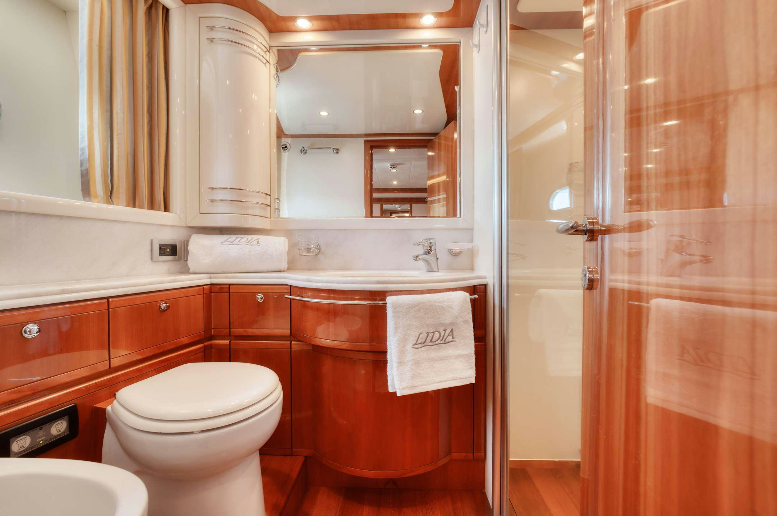 a bathroom with a toilet and a sink aboard LIDIA Yacht for Charter