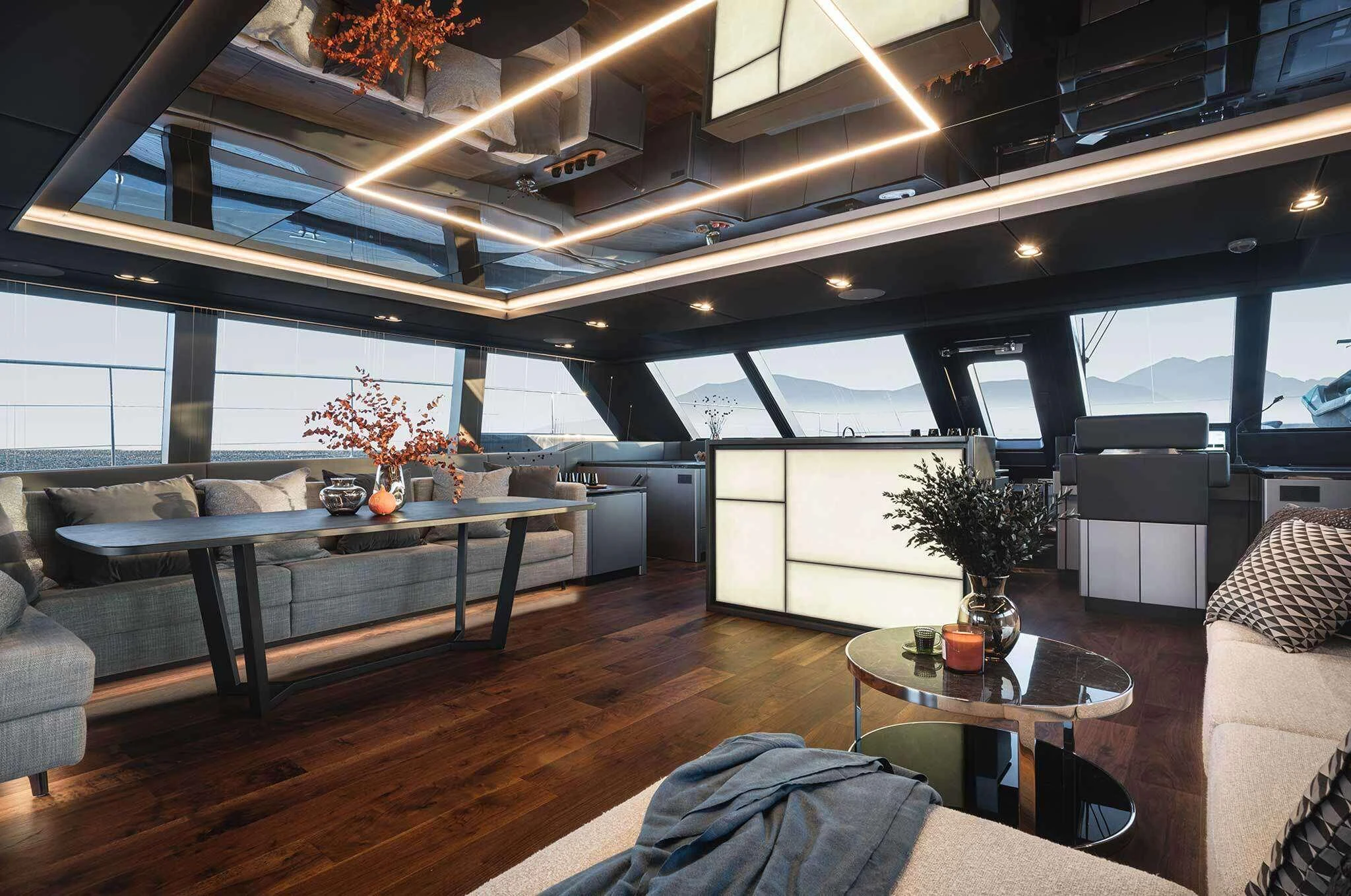 a living room with a wood floor aboard ALTEYA Yacht for Charter