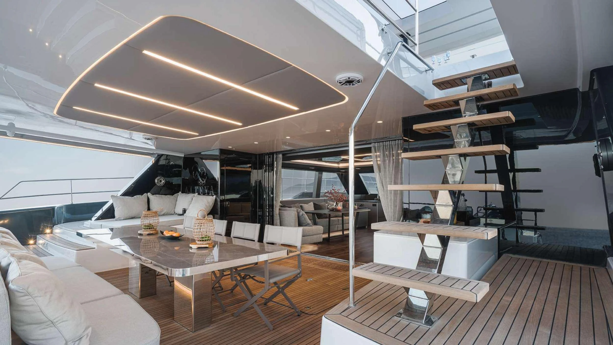 a room with a table and chairs aboard ALTEYA Yacht for Charter