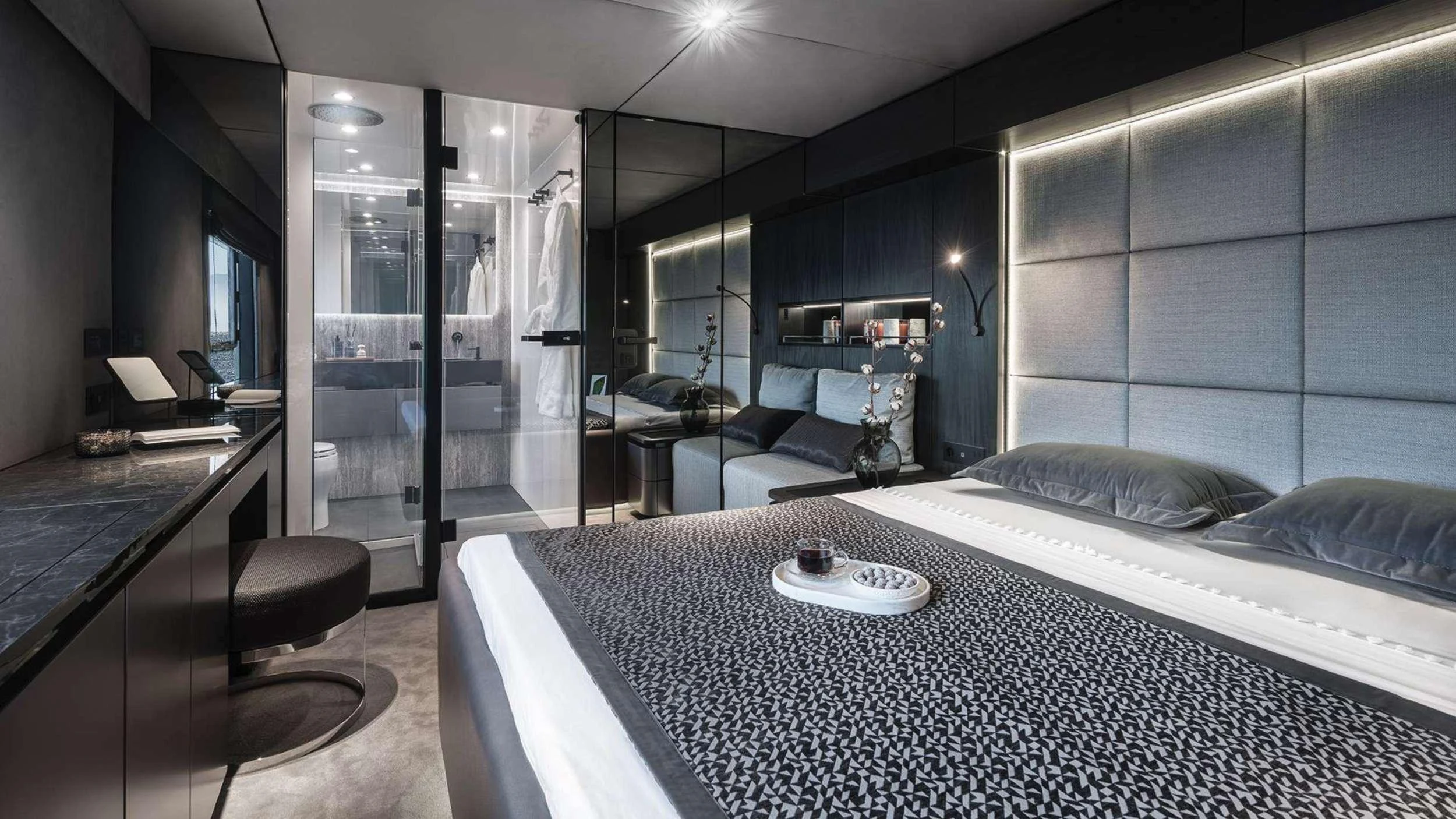 a large bedroom with a glass wall aboard ALTEYA Yacht for Charter