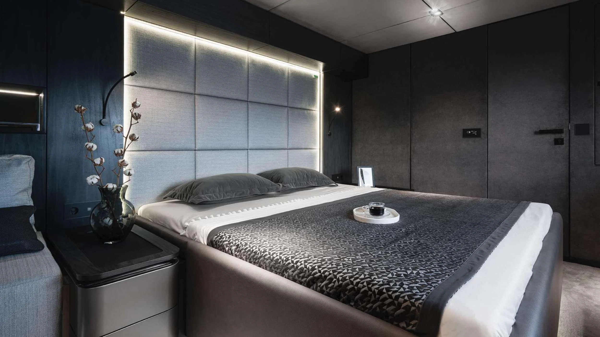 a bed with a white sheet and a white pillow aboard ALTEYA Yacht for Charter