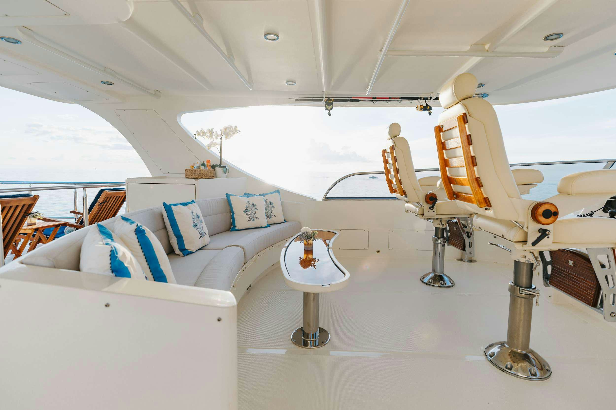 a boat with a table and couch aboard AURELIA Yacht for Charter