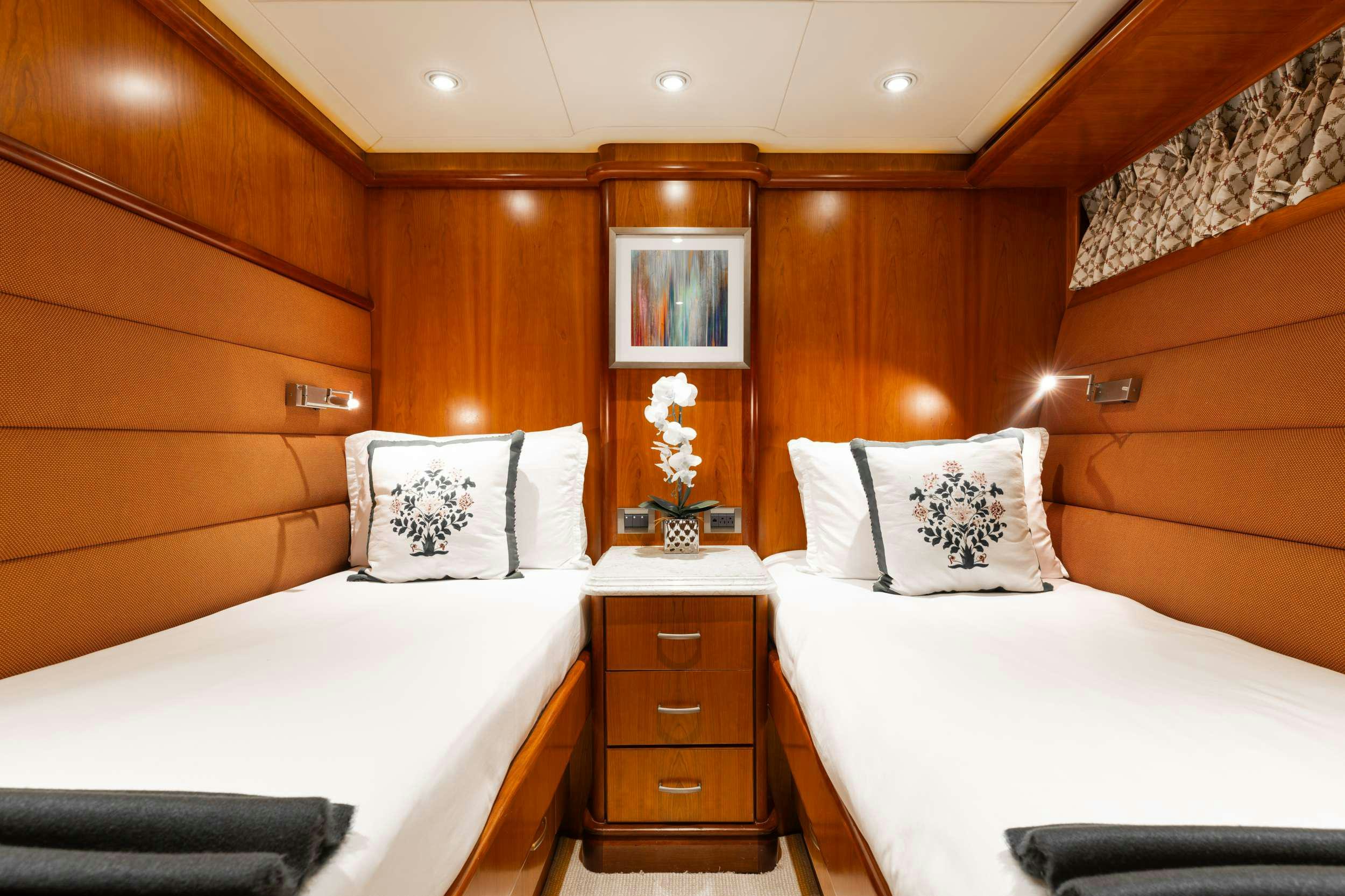 a room with two beds aboard AURELIA Yacht for Charter