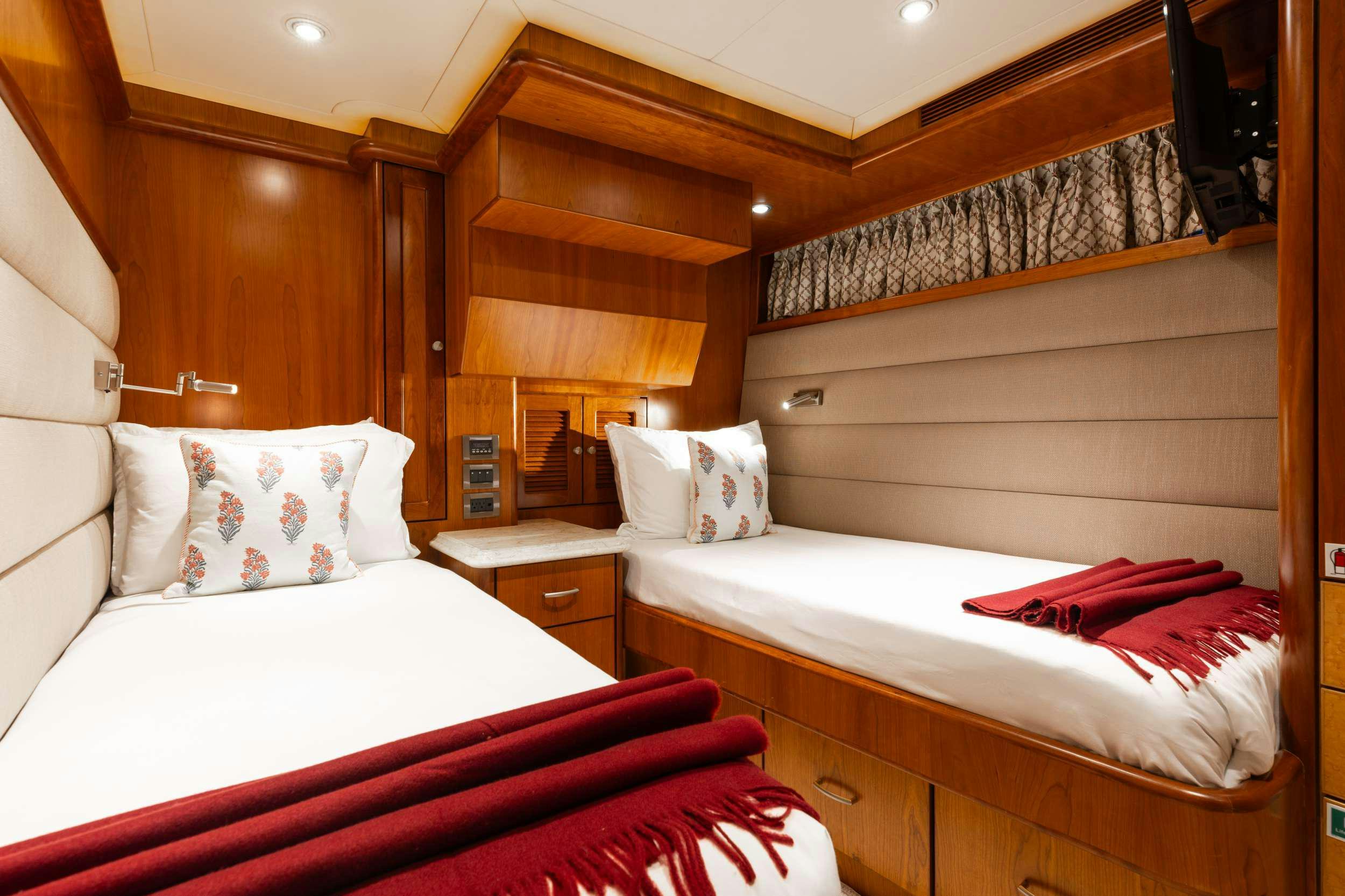 a couple of beds in a room aboard AURELIA Yacht for Charter
