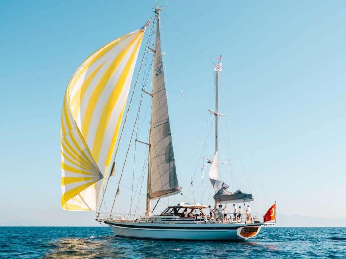 a sailboat with people on it aboard COLOMBAIO Yacht for Charter