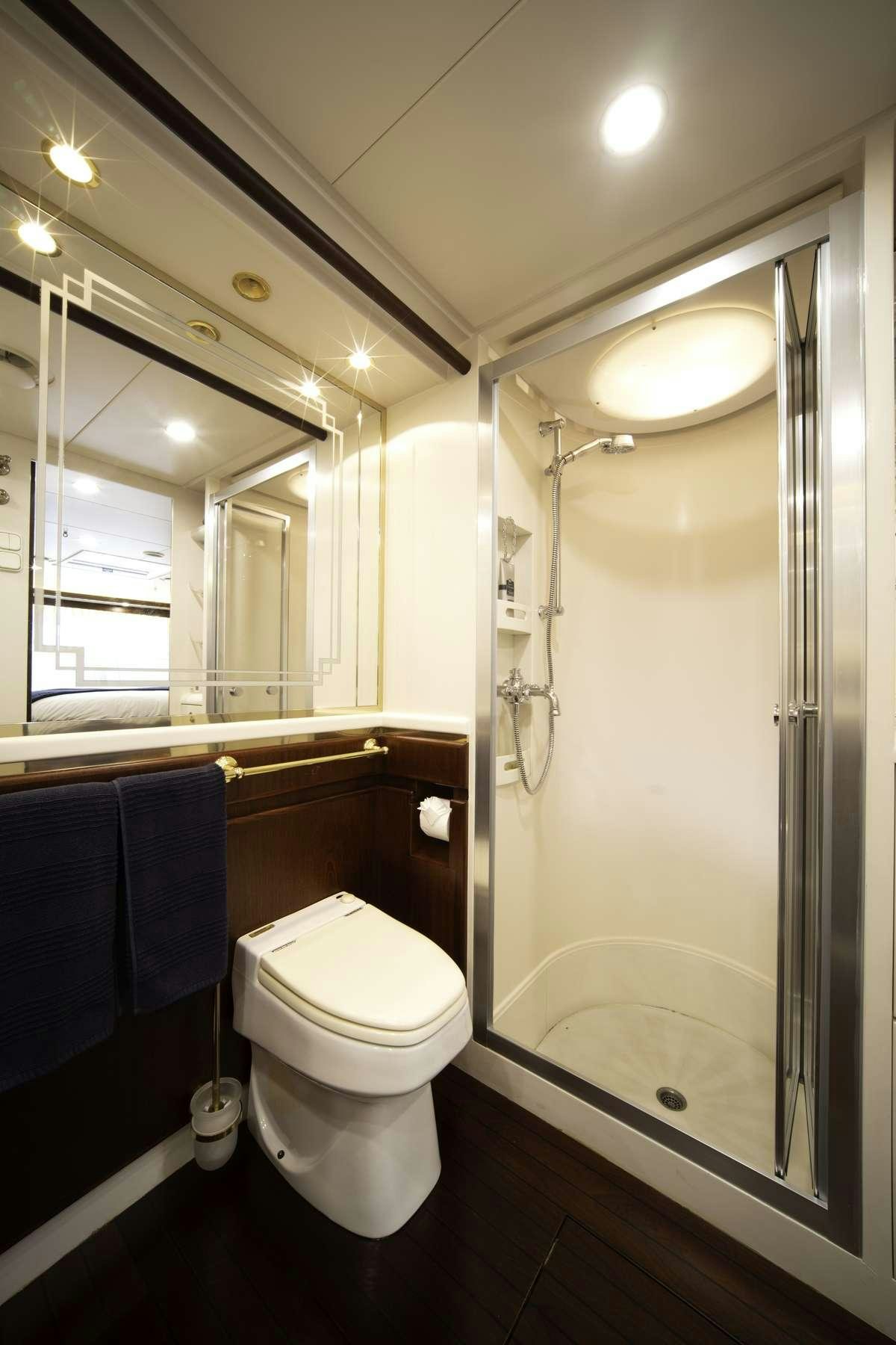 a bathroom with a glass shower aboard COLOMBAIO Yacht for Charter