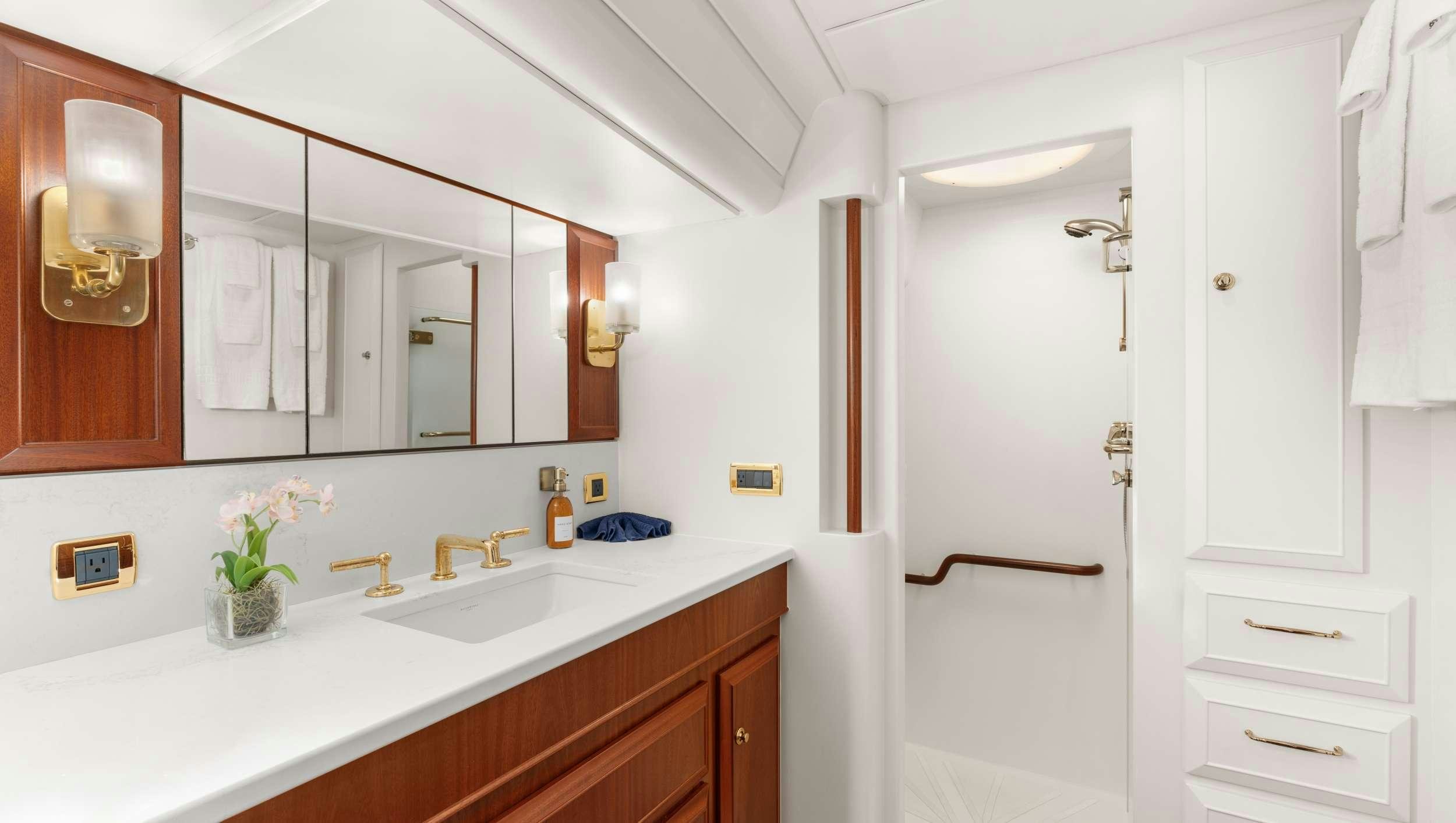 a bathroom with a white door aboard ABIDE Yacht for Charter