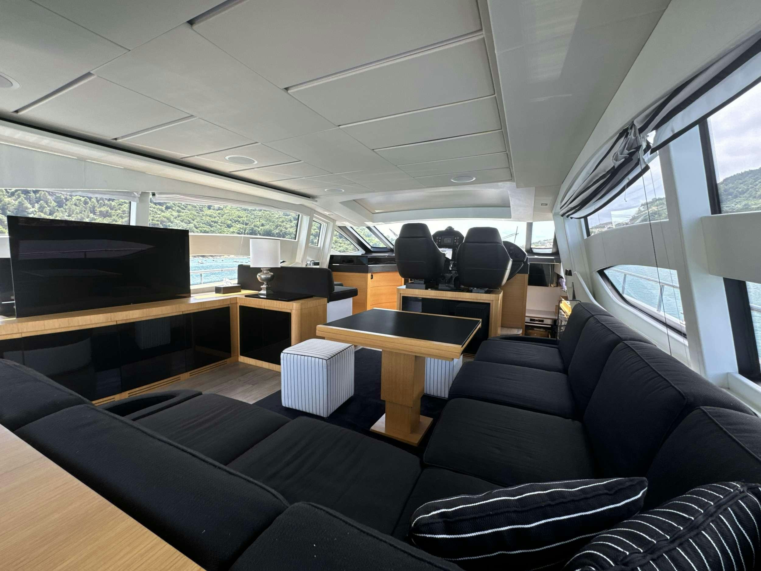 a room with a couch and a piano aboard SUE&NTILDE;O Yacht for Charter