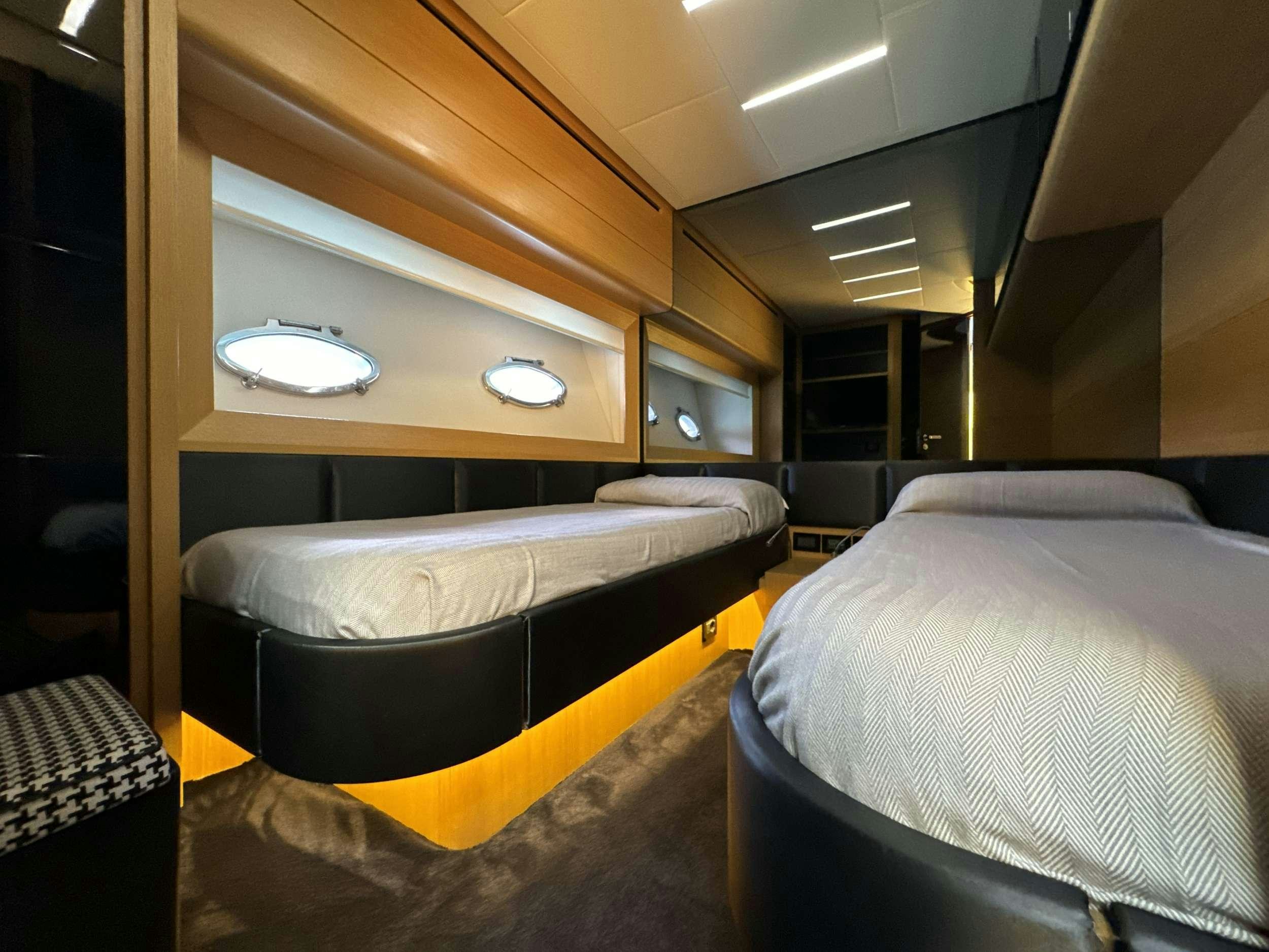 a room with two beds aboard SUE&NTILDE;O Yacht for Charter