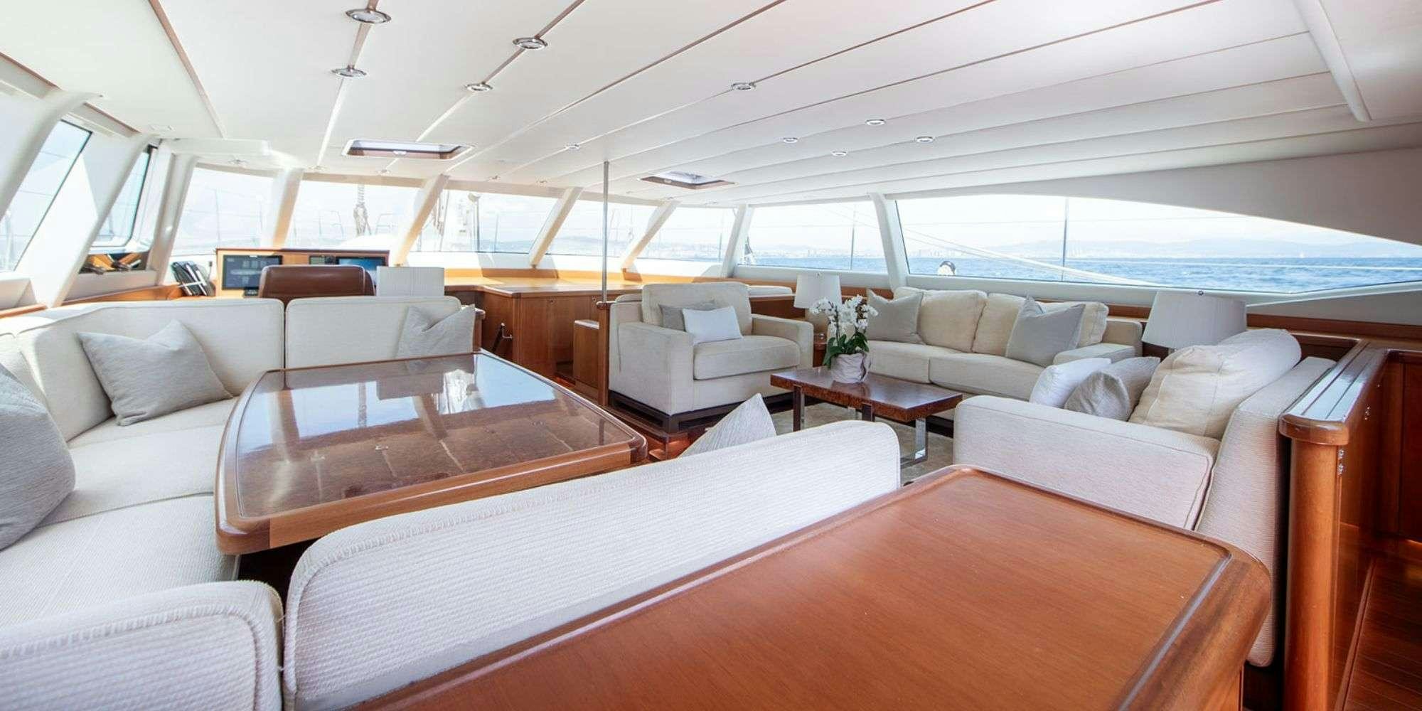 a room with a couch and a table aboard SELENA Yacht for Charter