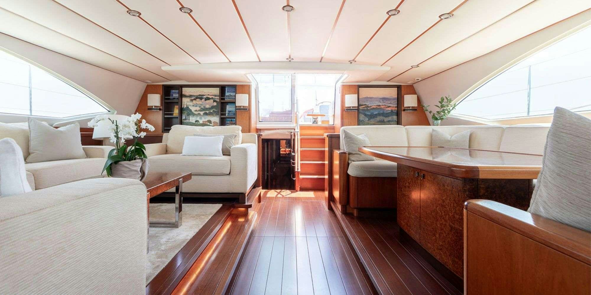 a living room with a wood floor aboard SELENA Yacht for Charter