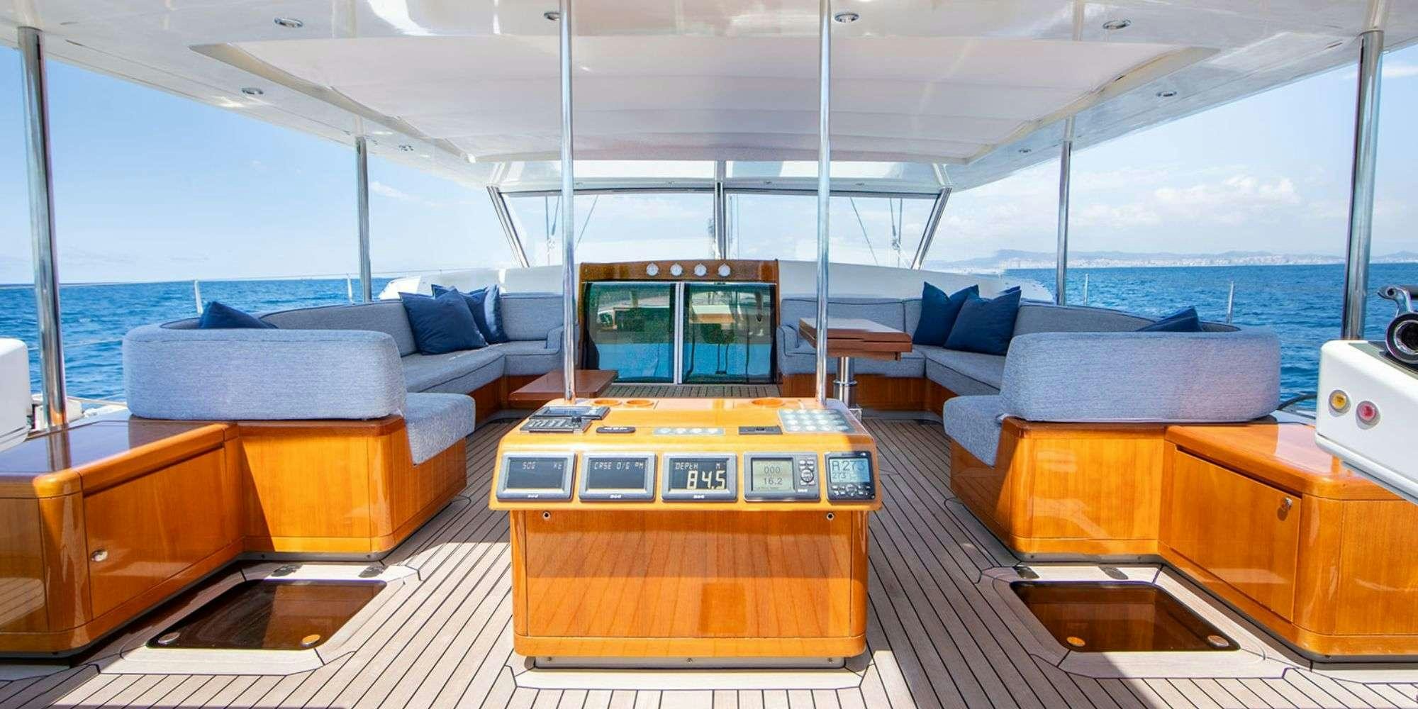 a room with a couch and a table aboard SELENA Yacht for Charter