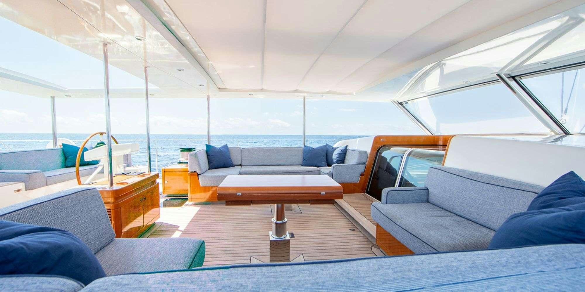 a living room with a couch and a coffee table aboard SELENA Yacht for Charter