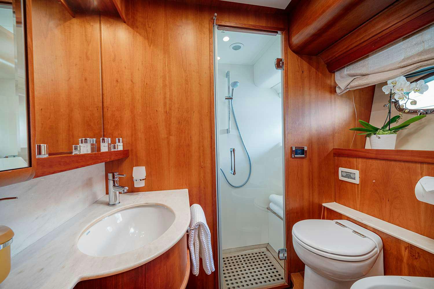 a bathroom with a toilet and sink aboard ROCK MOON Yacht for Charter
