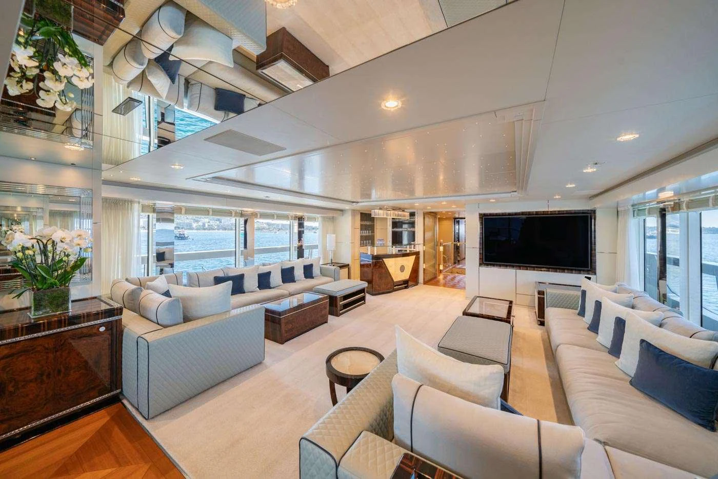 a living room with a large open floor plan aboard ALULIM Yacht for Charter