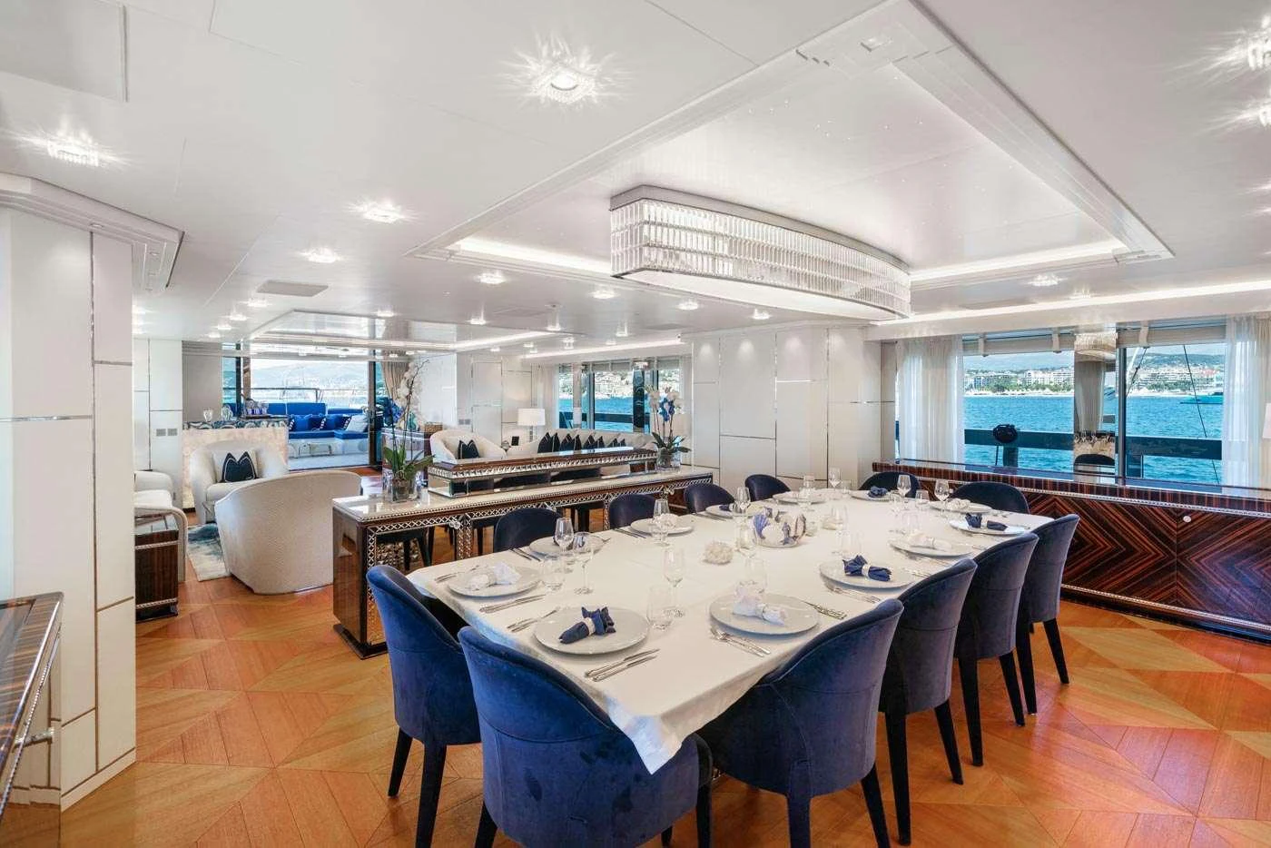 a large kitchen with a dining table aboard ALULIM Yacht for Charter