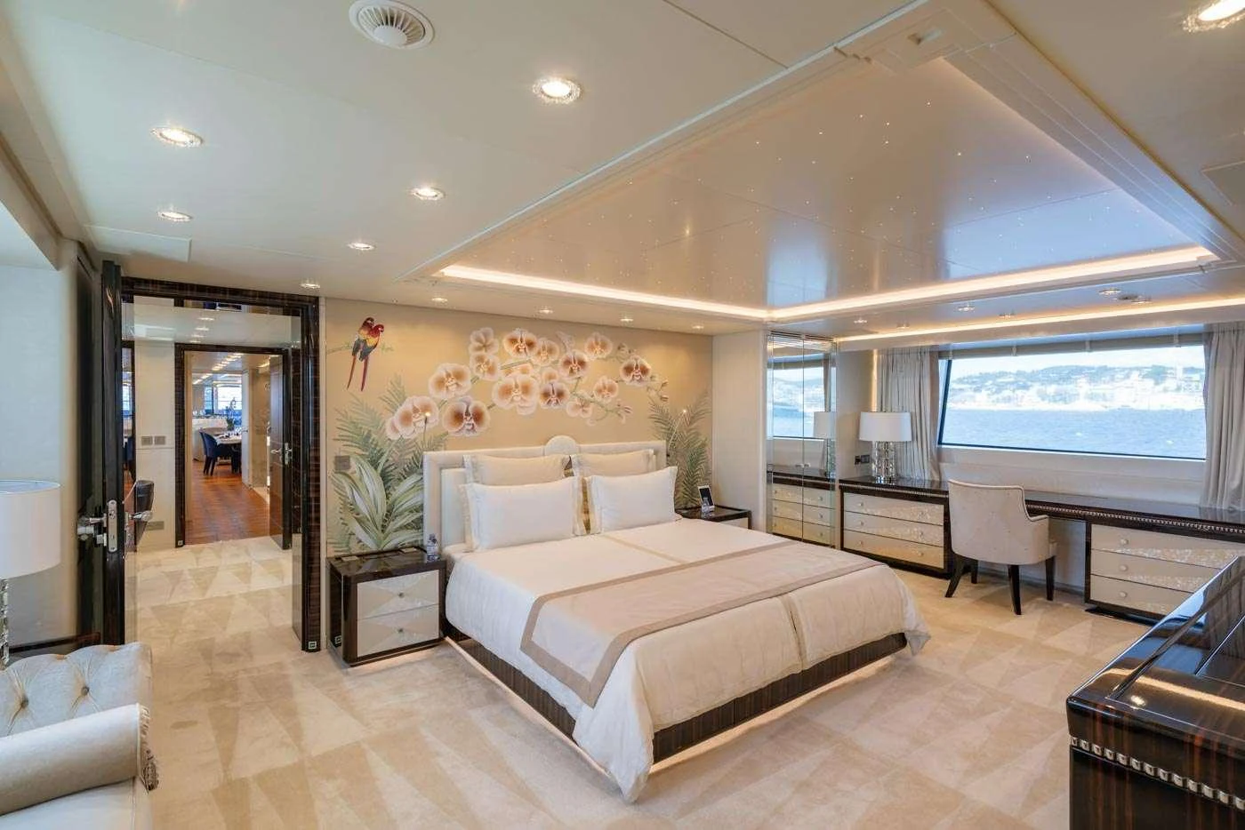 a large bedroom with a large bed aboard ALULIM Yacht for Charter