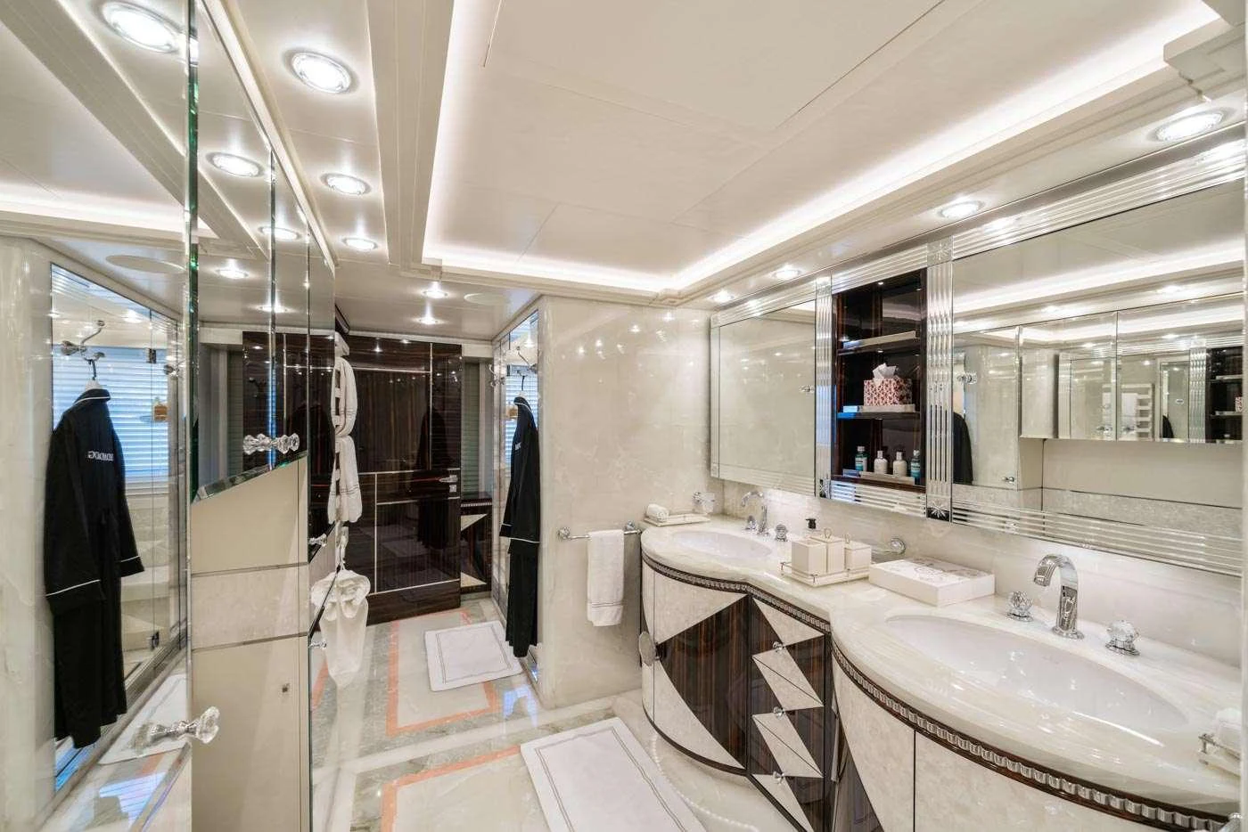 a bathroom with a large mirror aboard ALULIM Yacht for Charter