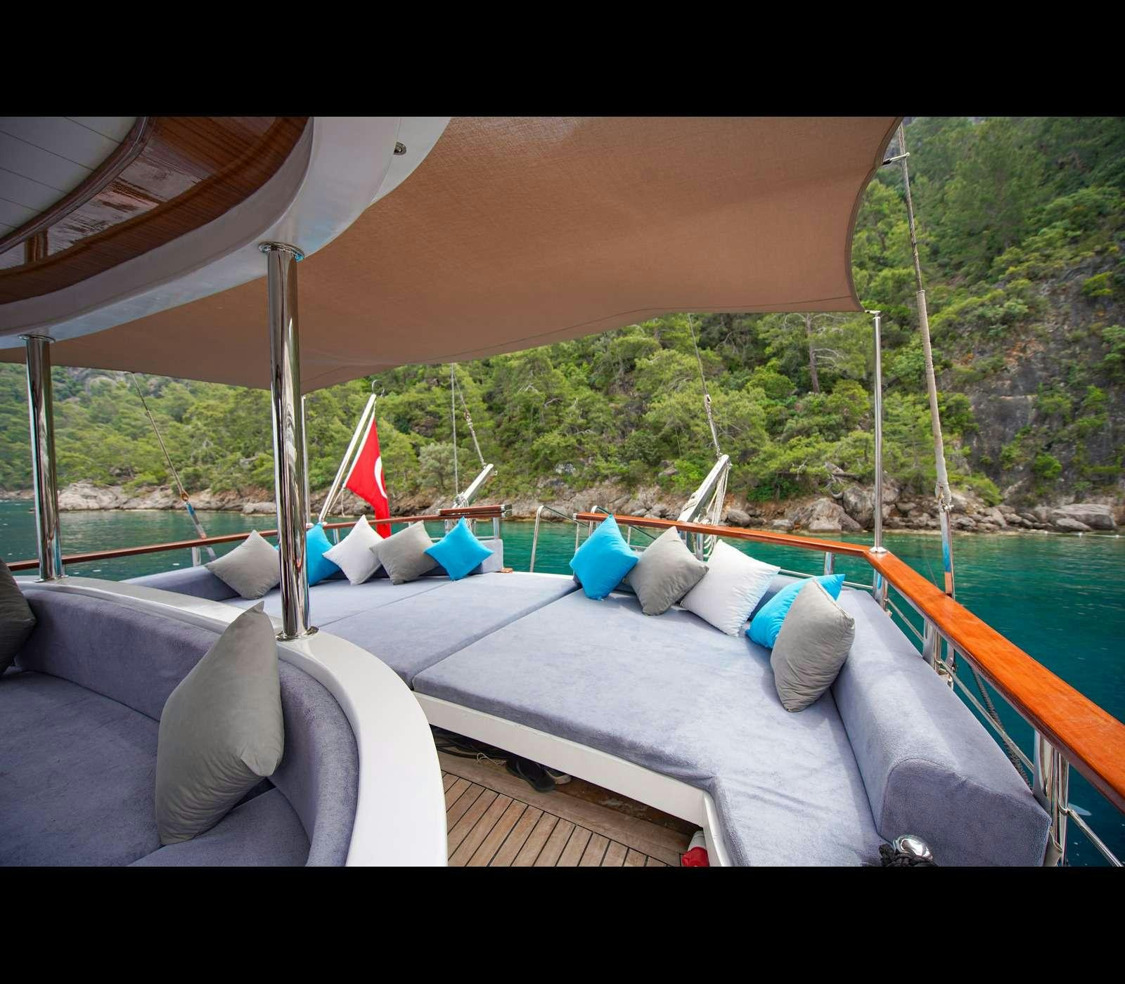 a pool with a view of a city and trees aboard QUEEN OF RTT GULET Yacht for Charter