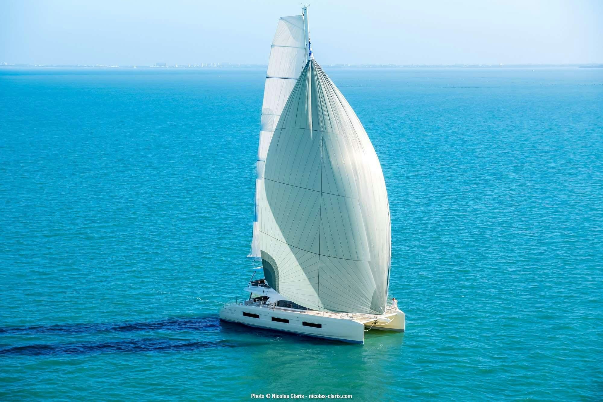 a sailboat in the water aboard LAGOON SIXTY5 2025 Yacht for Charter