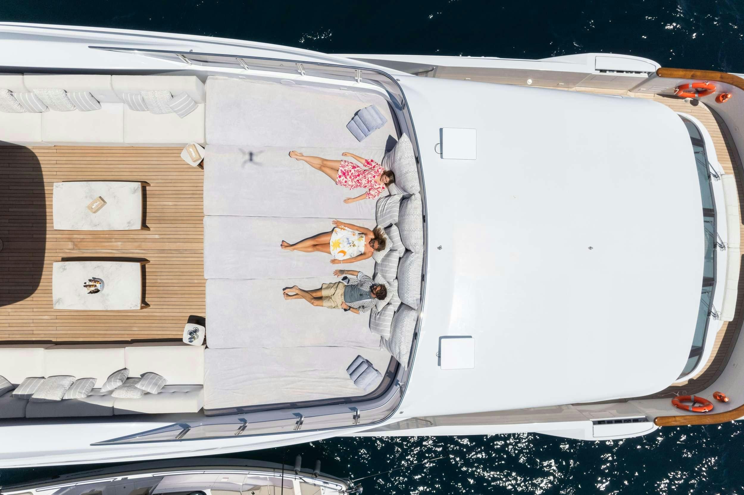 a white boat with a white boat on it aboard TITIAN PEARL Yacht for Charter