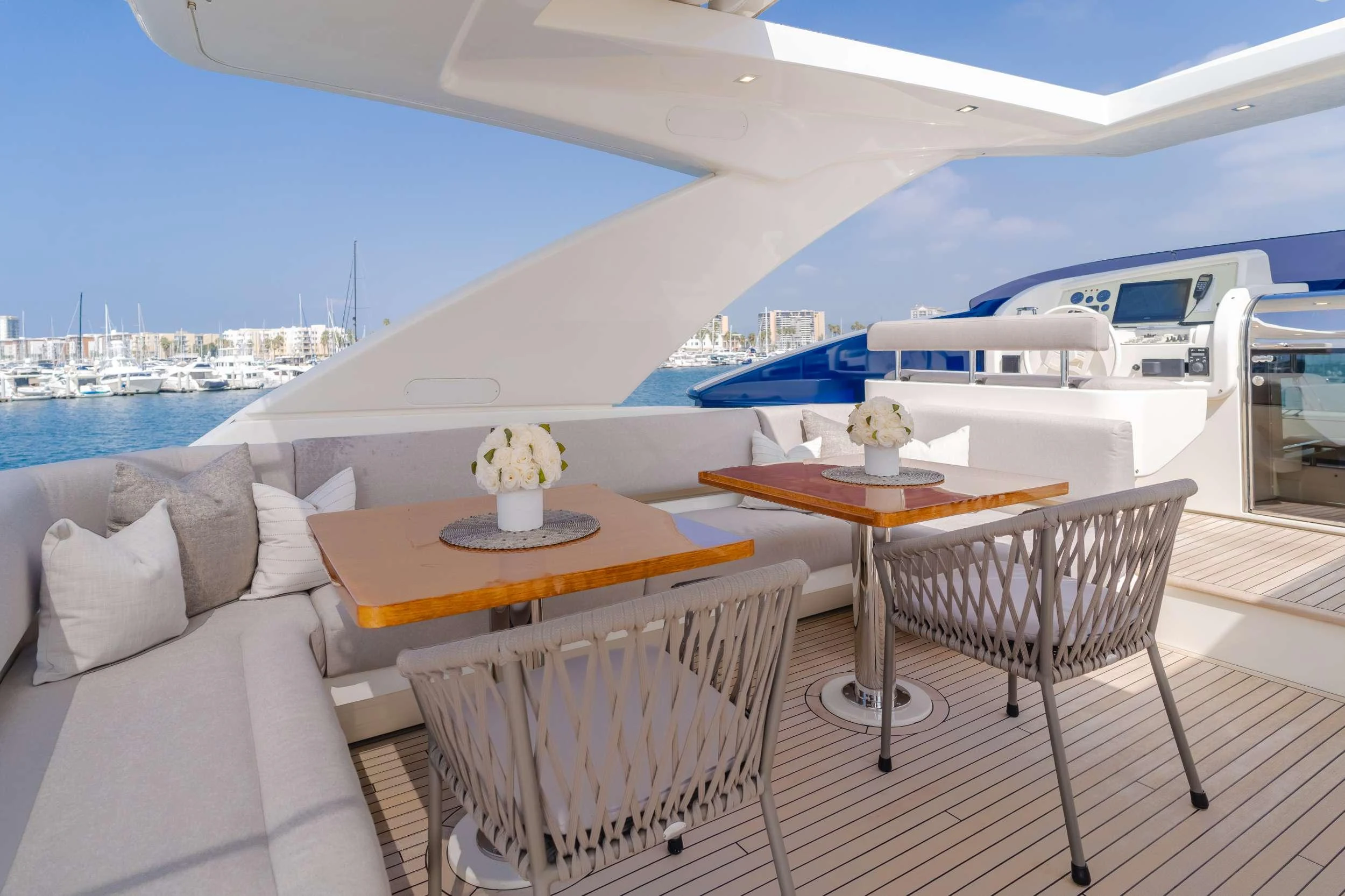 a table and chairs on a balcony aboard SOL SHINE Yacht for Charter